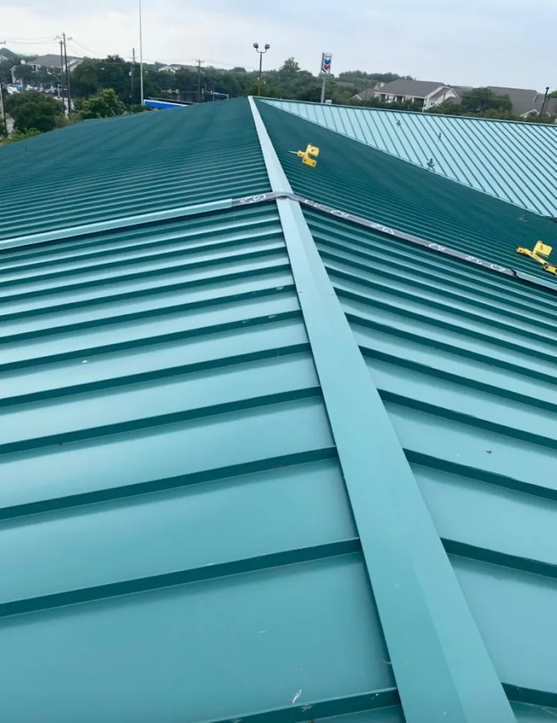 Green commercial metal roof ridge and valley for Metal Roof Repair in Malden