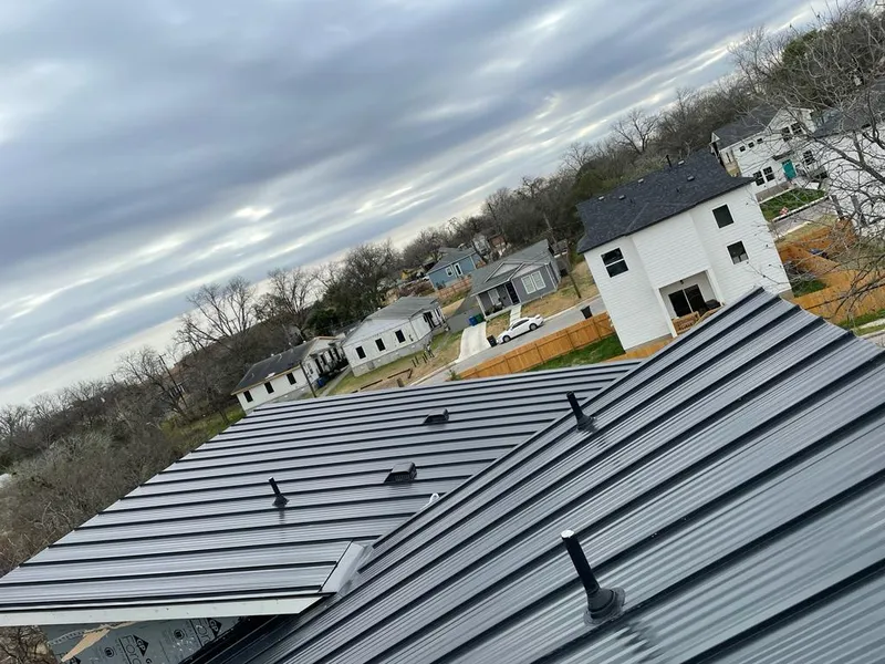 Standing seam metal roof panels with vents for Skylight Repair in Malden